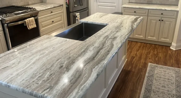 Granite kitchen island countertop with a half bullnose edge and an undermount sink.